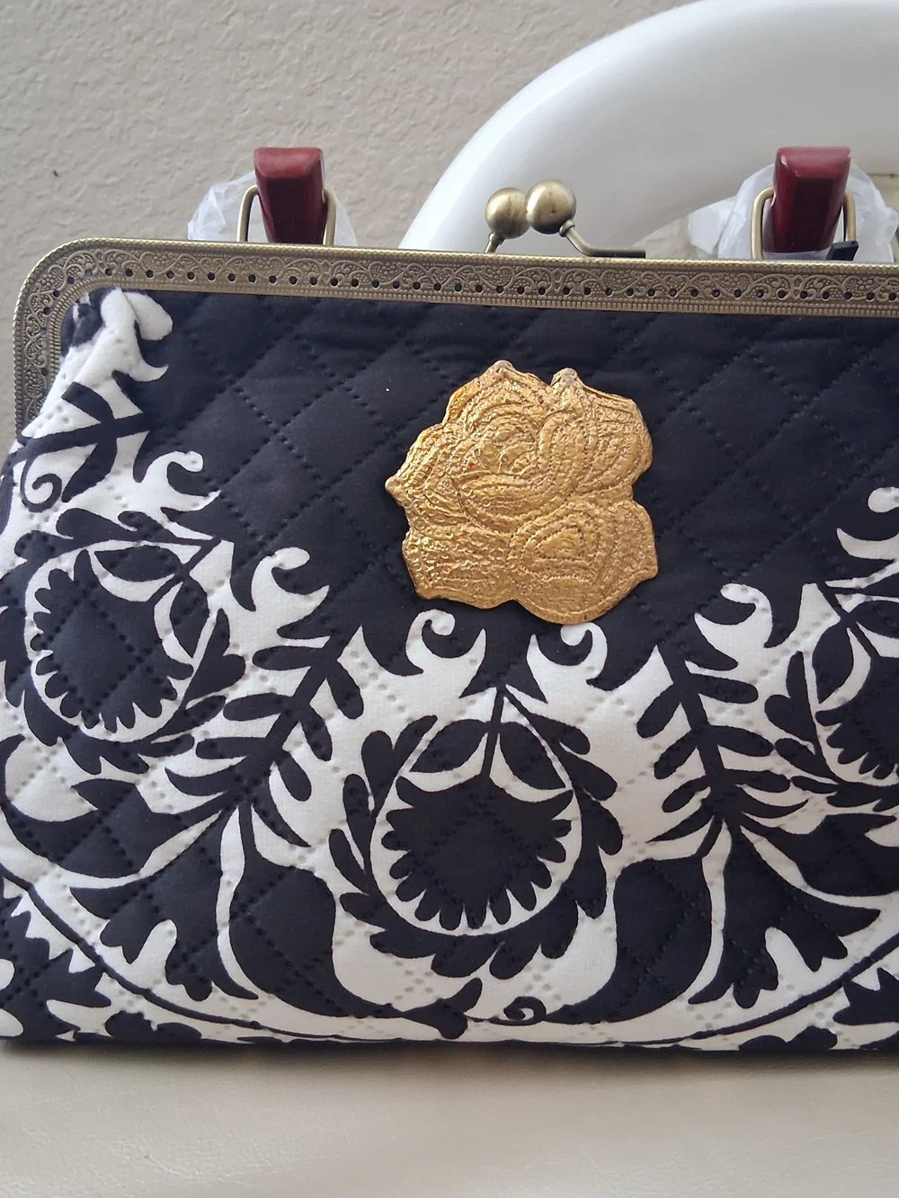 Black & White Quilted Floral Frame Clutch with Gold Rose Accent